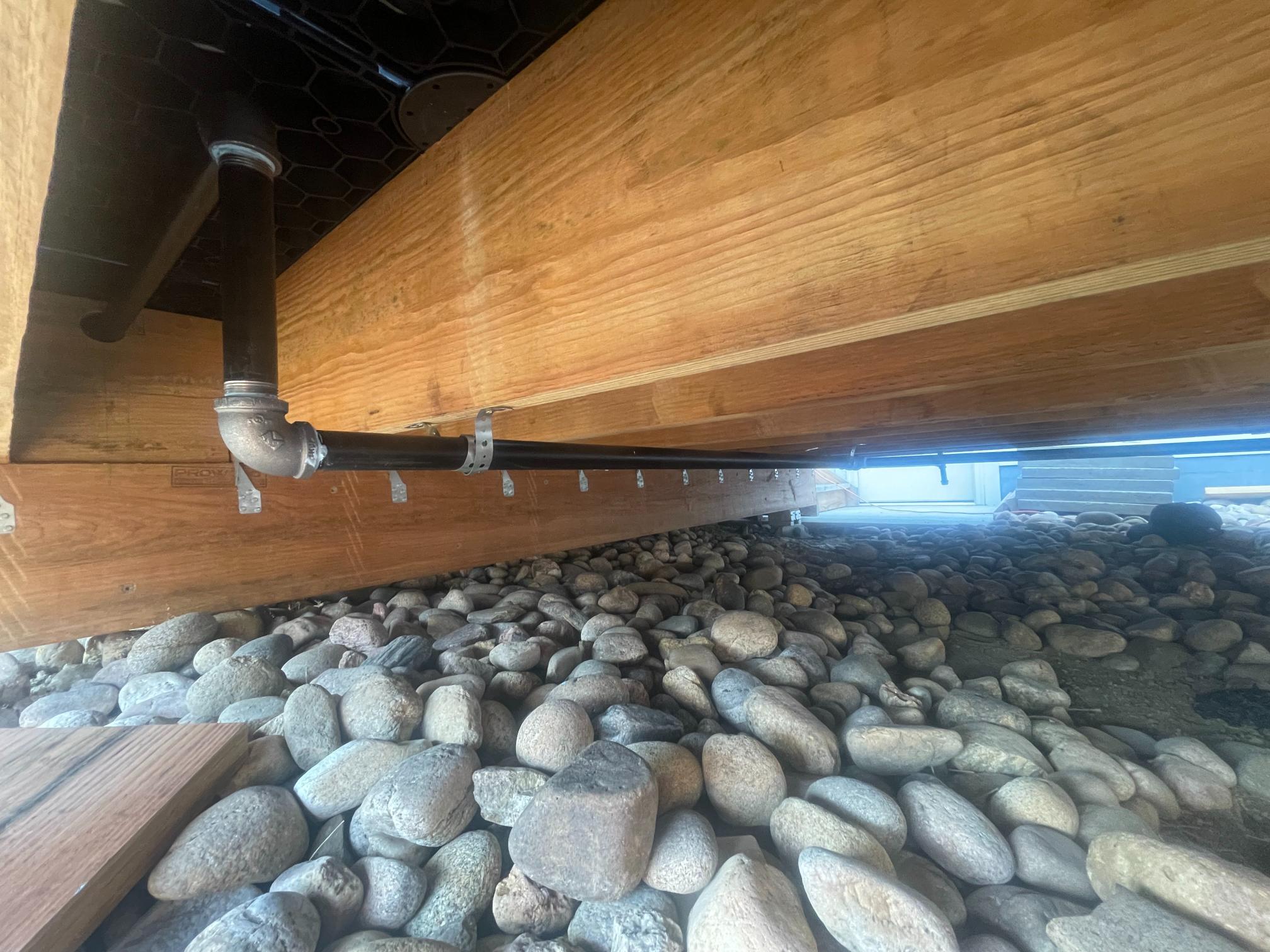 Gas line plumbing work in a Colorado crawlspace